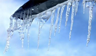 Icicles hanging from a rooftop to symbolize the icy weather that caused our slip and fall attorneys' client to be injured.