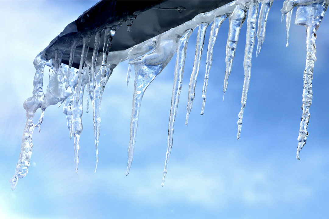 Icicles hanging from a rooftop to symbolize the icy weather that caused our slip and fall attorneys' client to be injured.