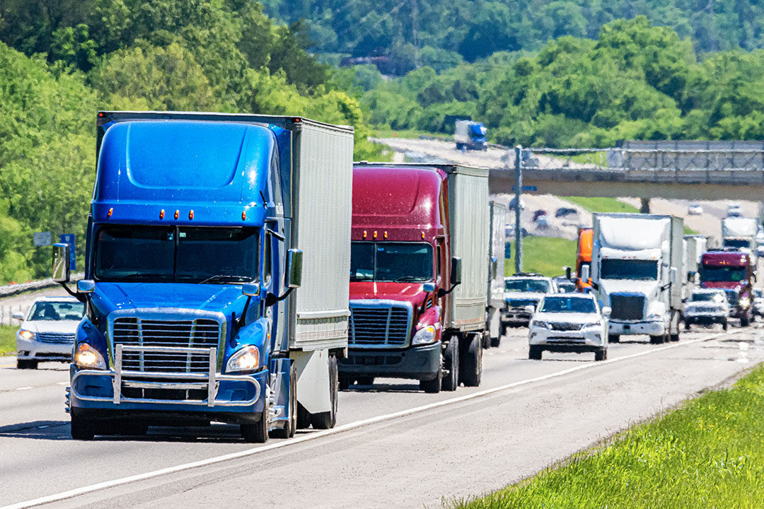 heavy traffic with tractor trailers and semi trucks on highway - missouri truck accident attorneys