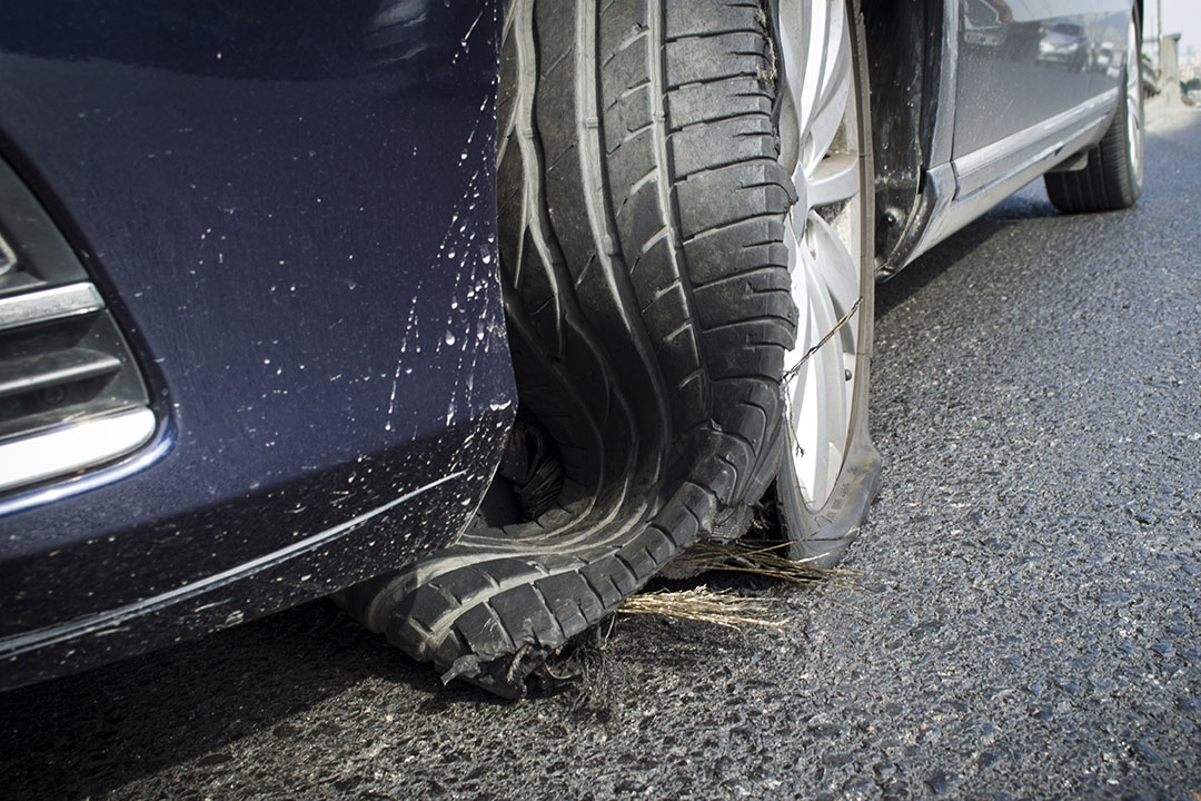 An image of a tire tread separation, where the tread of the tire is separated from the rest and causes danger while driving.