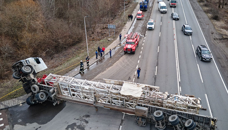 cars backed up on highway and truck overturned from jackknife accident