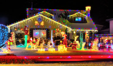 Photo of a house covered with christmas lights and decorations