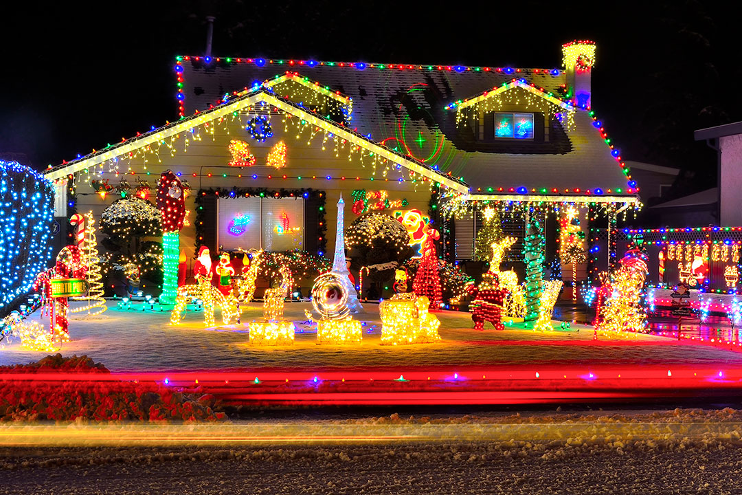 Photo of a house covered with christmas lights and decorations